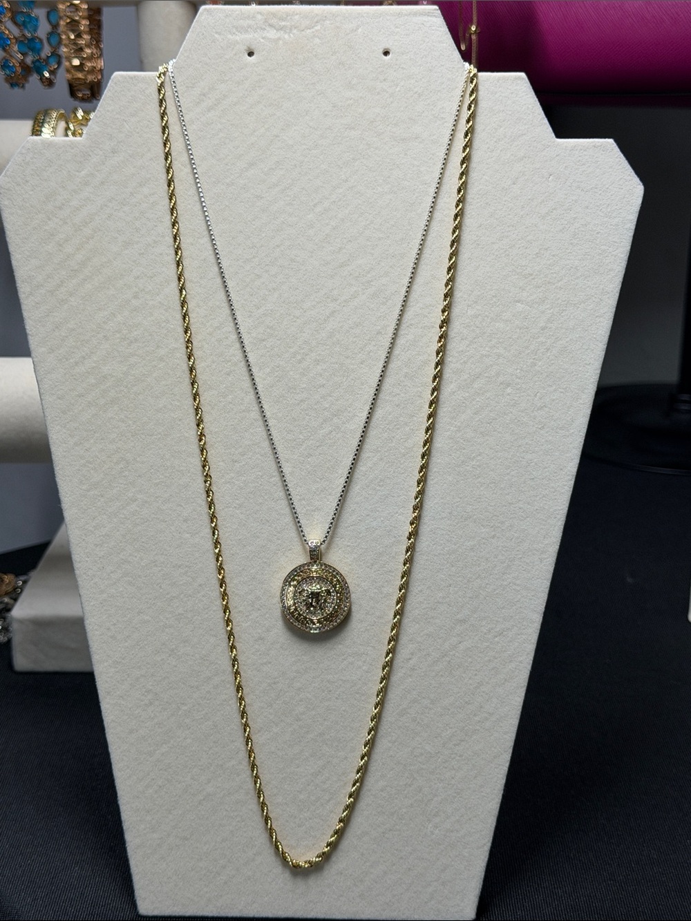 18k triple plated 18” white gold box chain w/ Medusa pendant.